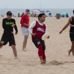 Vincent Chang secures the disc while the Brown family works on their line dancing moves